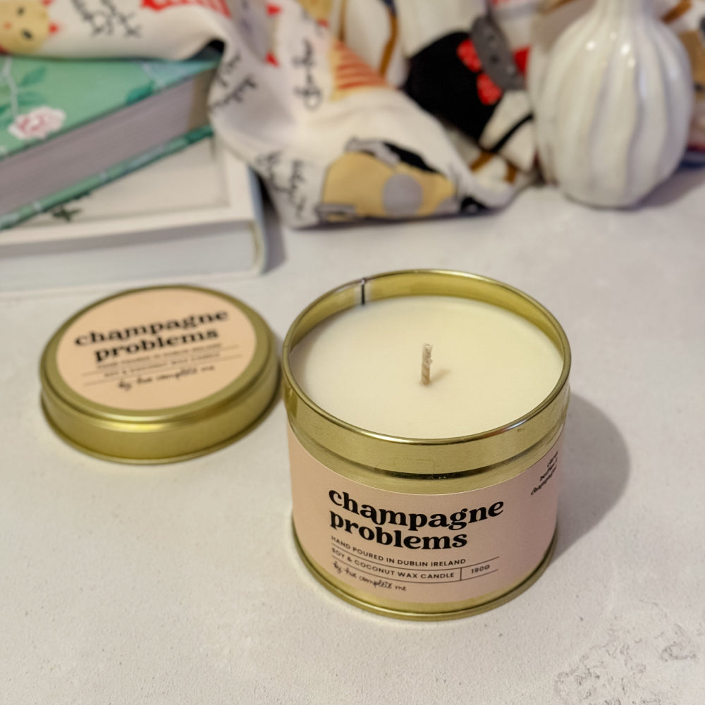 Champagne Problems gold tin candle with orange, mimosa, and champagne scent – 45+ hour burn, made in Ireland, perfect for Taylor Swift fans