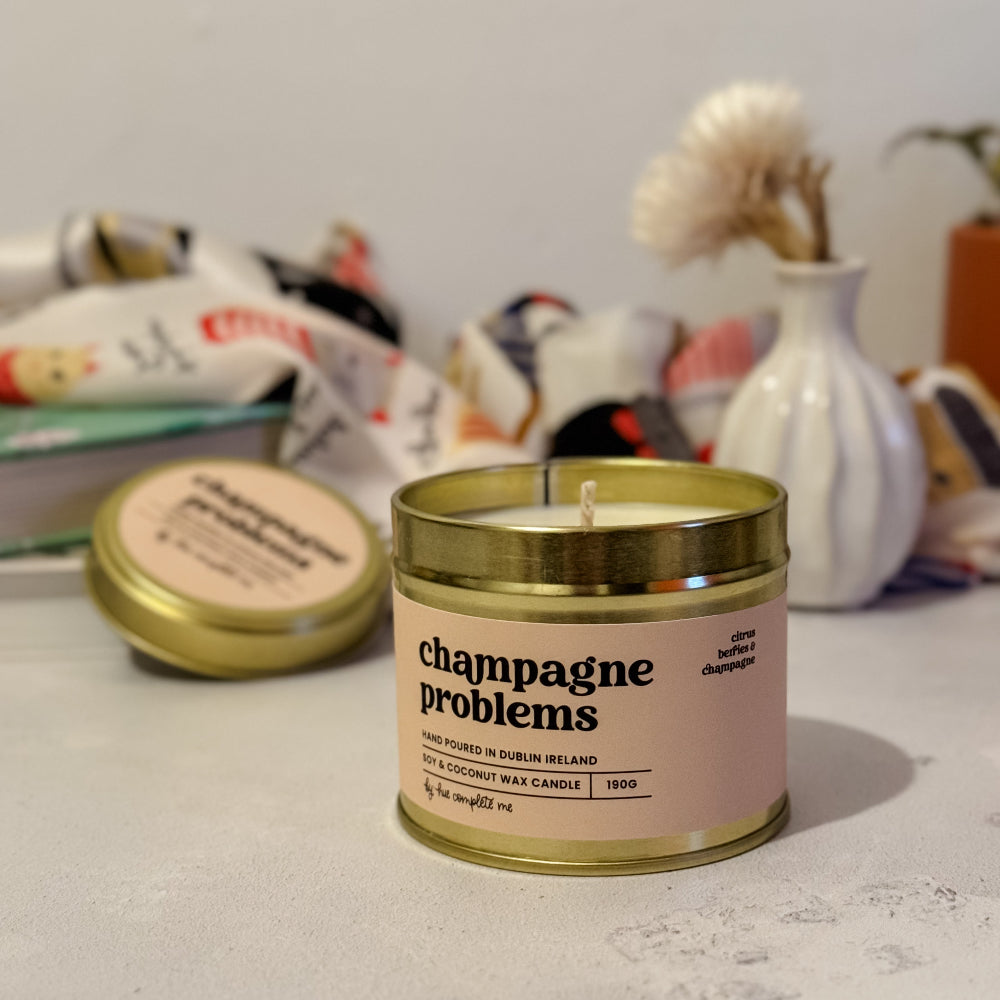 Gold tin candle with mimosa, orange, and champagne aroma – Champagne Problems scent for Taylor Swift lovers, burns 45+ hours