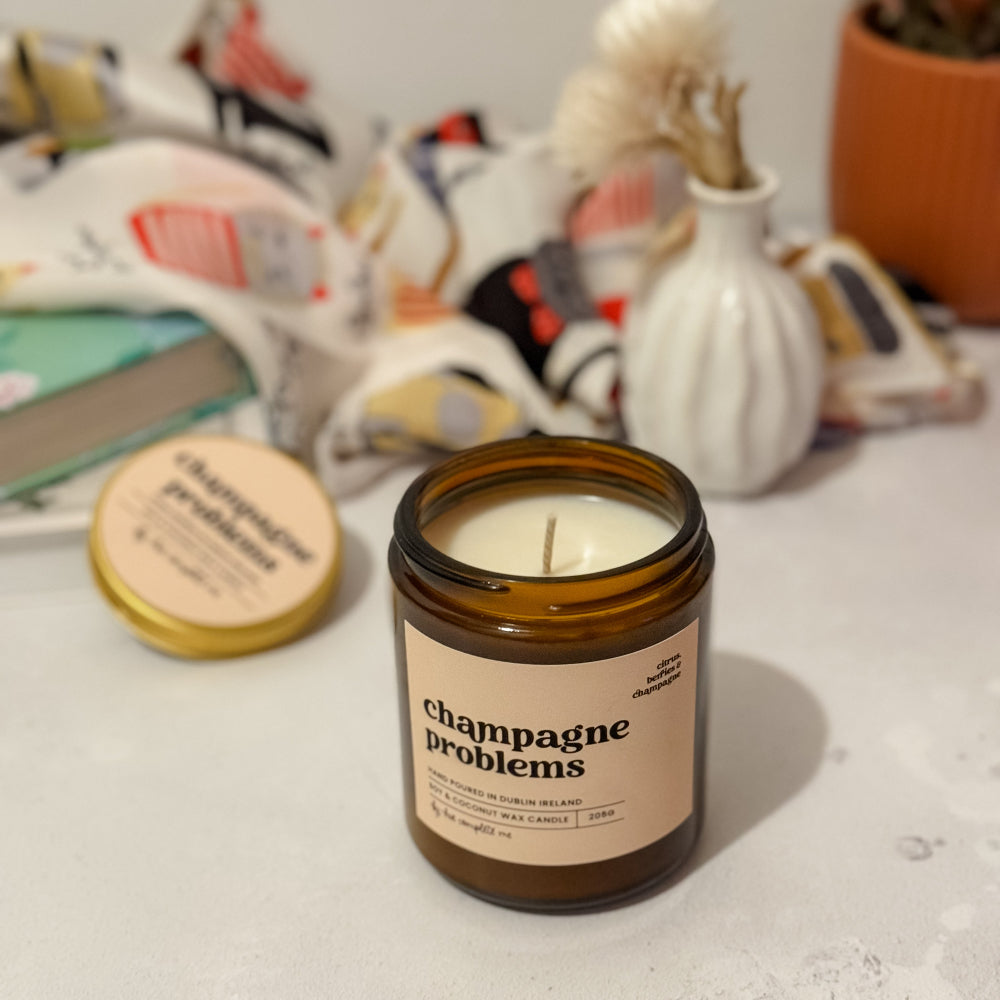 Swiftie gift idea – Champagne Problems candle in amber jar with orange, mimosa, and champagne fragrance, long-lasting 45+ hour burn. Limited stock one of a kind. 