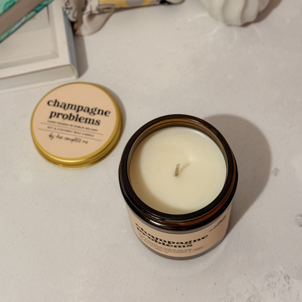 Luxury amber candle for Taylor Swift fans – Champagne Problems scent with citrus and bubbly notes, hand-poured in Ireland. Limited edition 